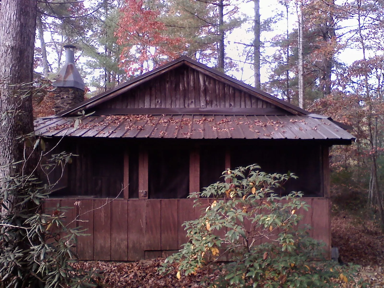 Metal roof over the screened porch of a rustic cabin in Middletown